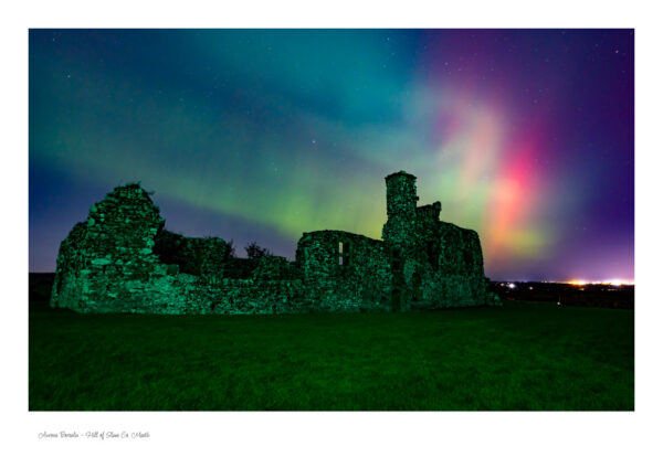 The spectacular Aurora Borealis captured over the beautiful Hill of Slane showing the ruins on the Hill