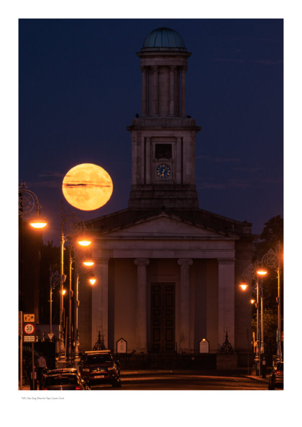The Moon rising behind the Pepper Canister Church